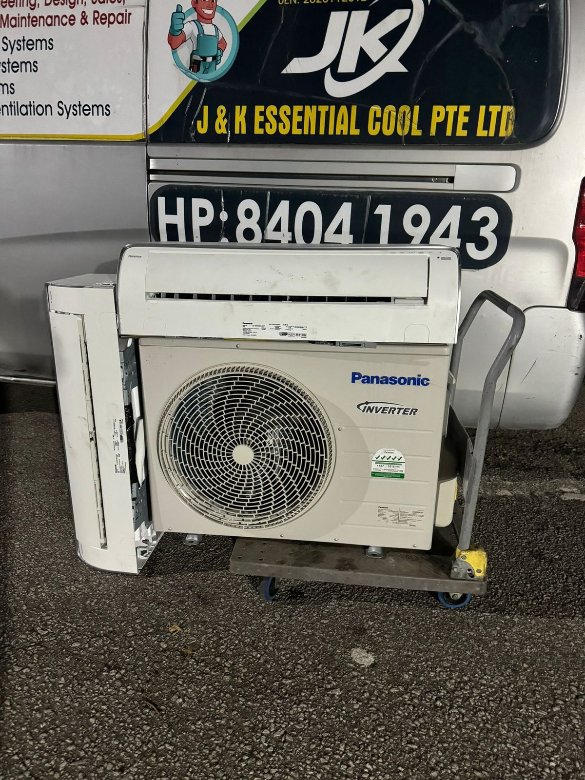 J & K Essential Cool servicing an aircon unit